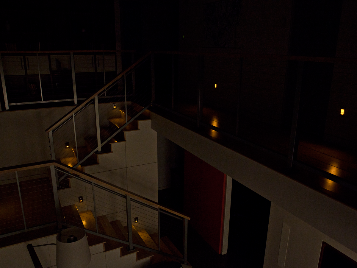 Aerial view from the second floor of the Honda Smart House with warm amber lighting at night