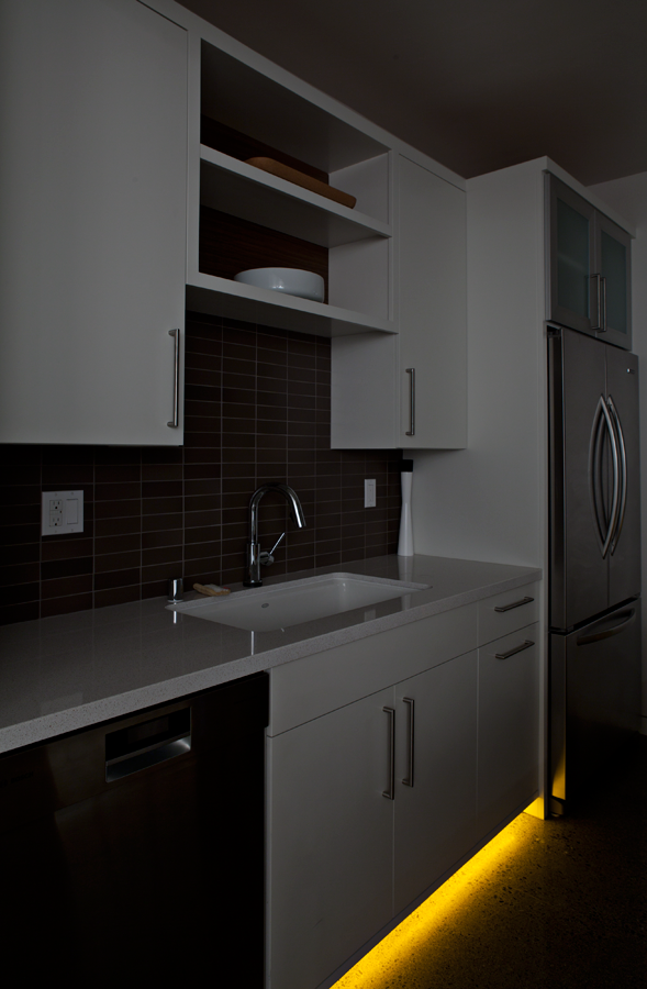 Honda Smart Home kitchen at night with amber colored under cabinet lighting