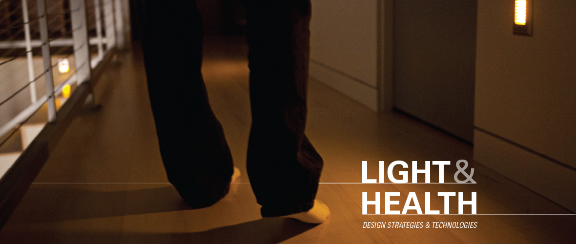 Light and Health: Design Strategies and Technologies (A close up of a persons feet as they walk down a hallway in amber lighting)