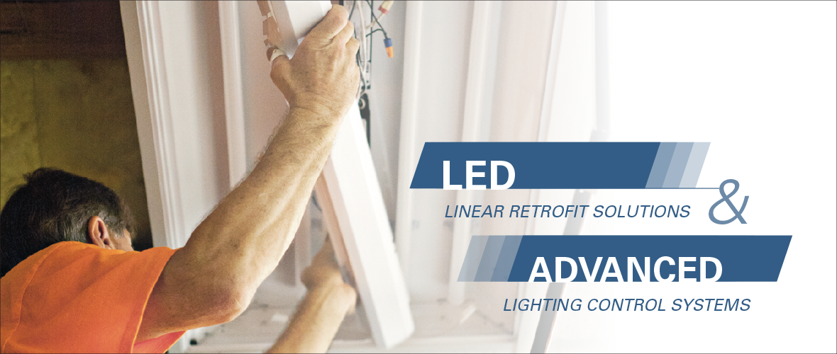 LED Linear Retrofit Solutions and Advanced Lighting Control Systems (A person putting up a linear led into a light fixture)