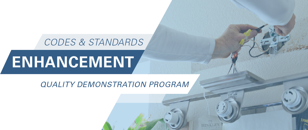 Codes and Standards Enhancement-Quality Demonstration Program (Someone working on the electrical wiring of an outlet)