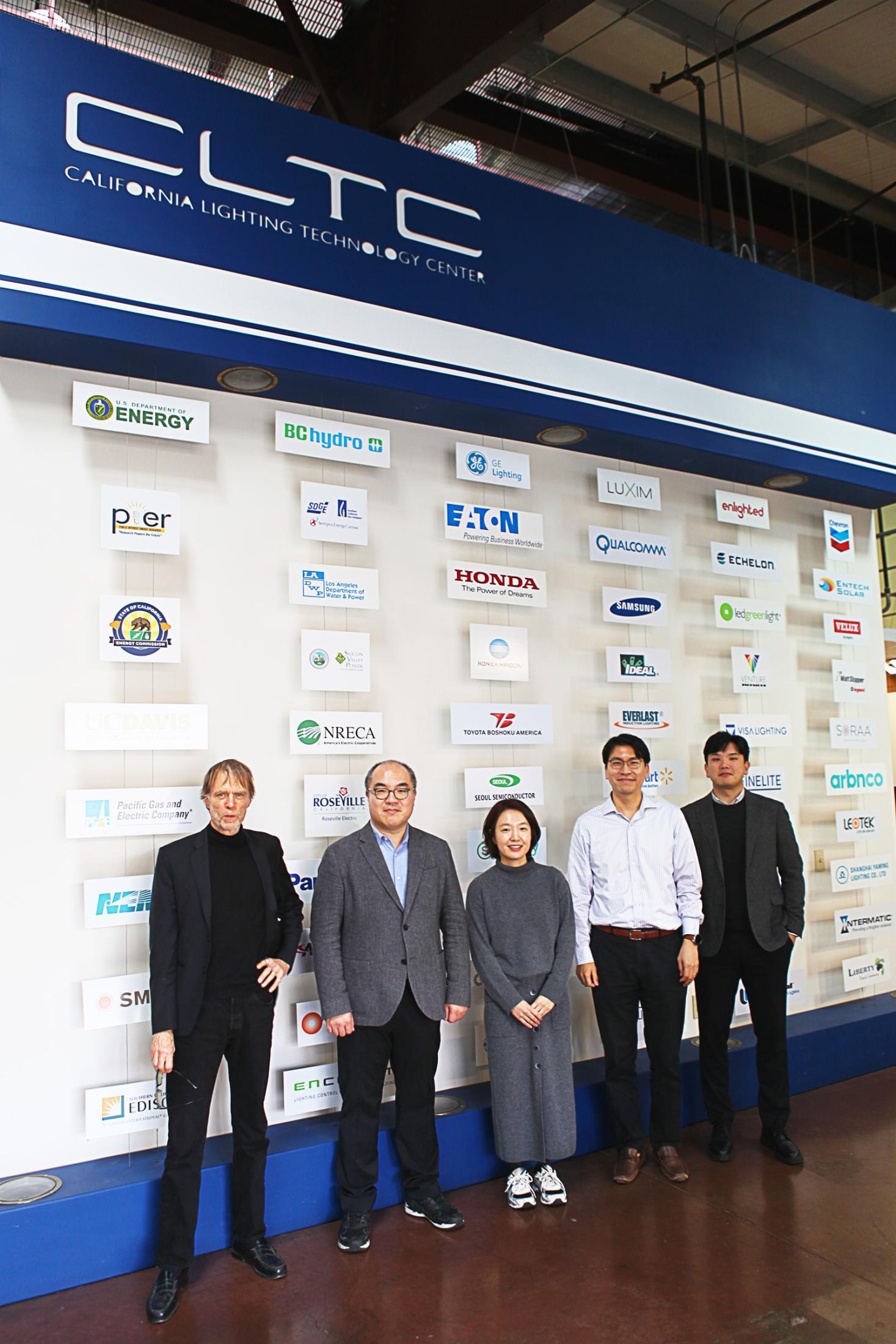 Professors Michael Siminovitch, Youngchul Kim, Soh Young In, Jae Yong Suk, Albert Tonghoon Han standing in front of CLTC affiliate wall