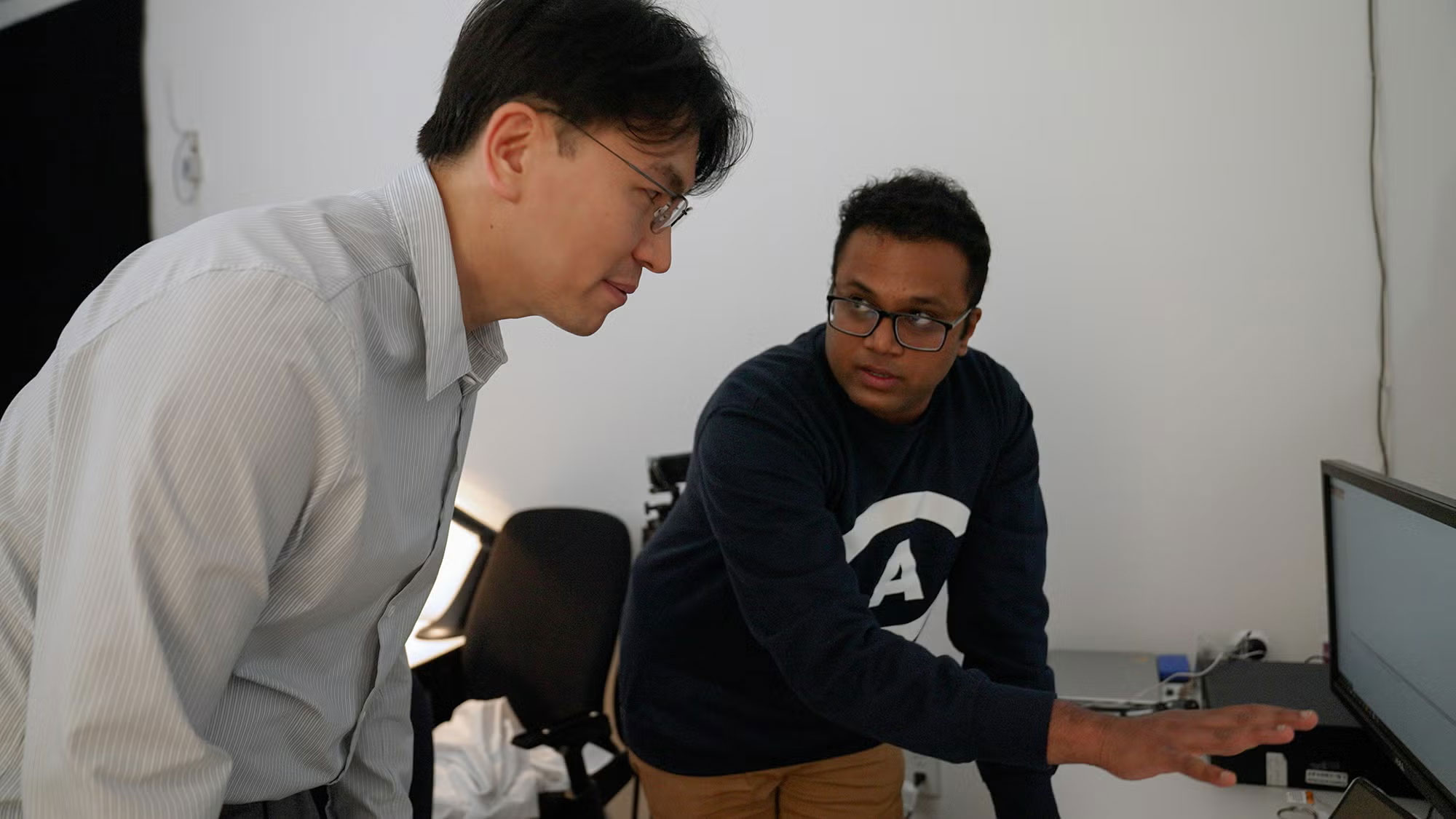 Jae Yong Suk, left, faculty co-director of the California Lighting Technology Center, and Sreenivasan Meyyappan, assistant project scientist with the UC Davis Center for Mind and Brain, discuss the process for an experiment in The Color Lab. 