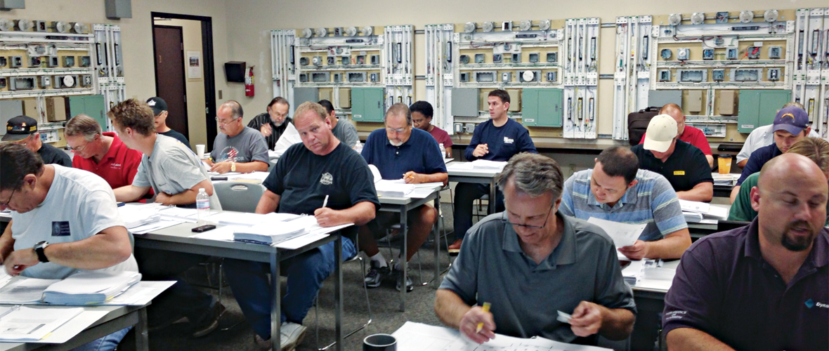 A classroom of people studying