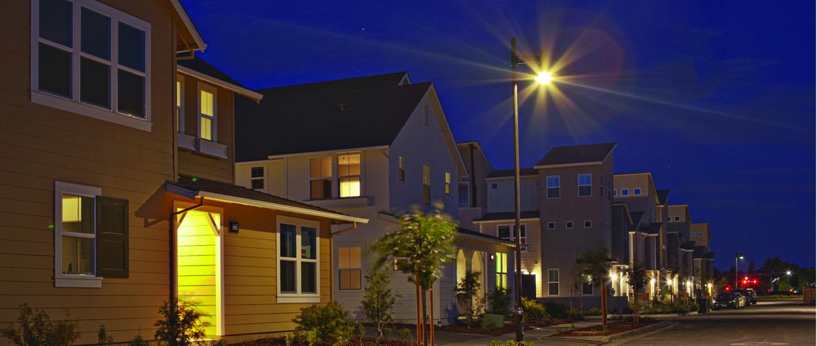 Row of houses with street lighting