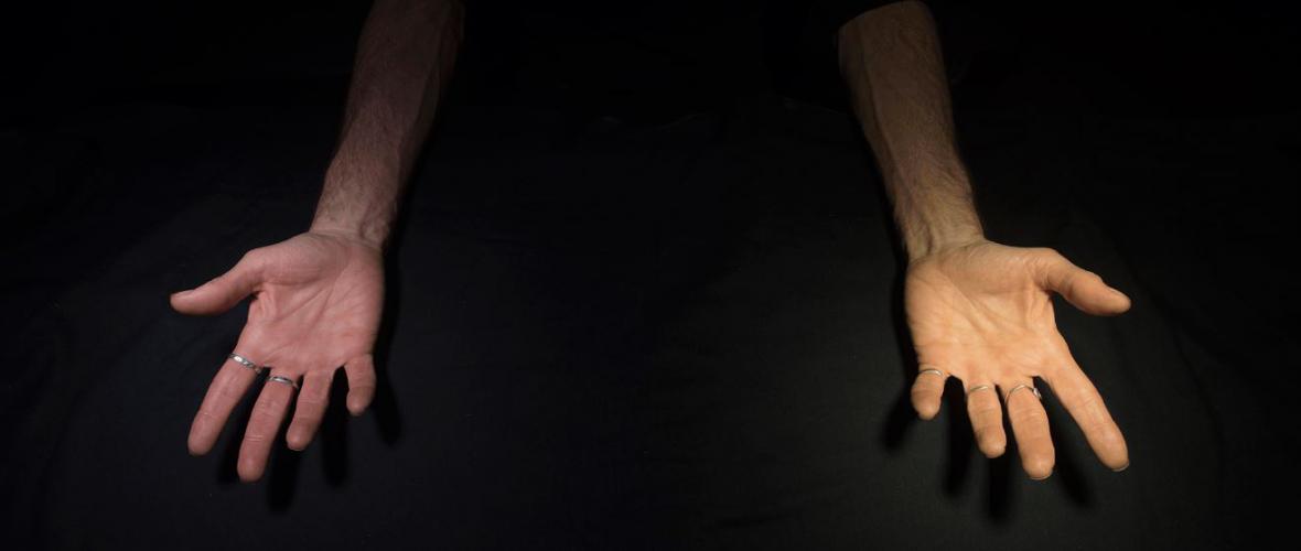 Two hands under two different types of lighting showing how light temperature changes color perception 