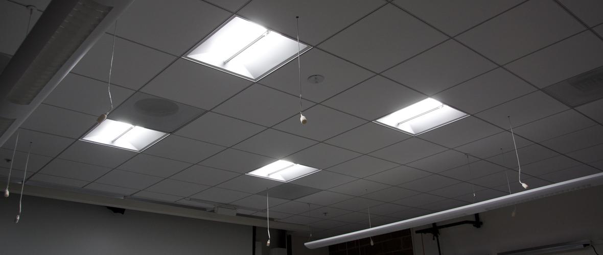 Four square lighting fixtures in the ceiling 