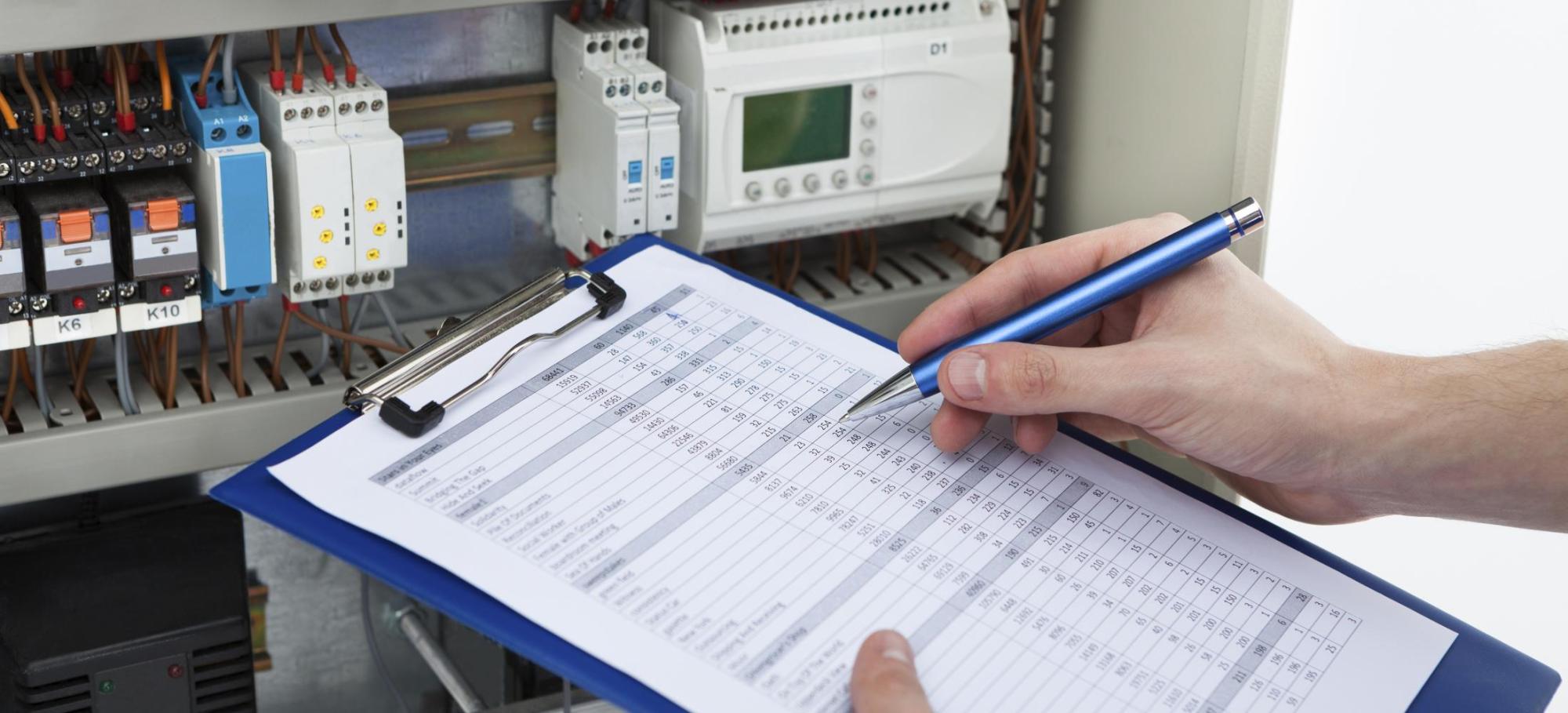 Close up of a persons hand filling out a form