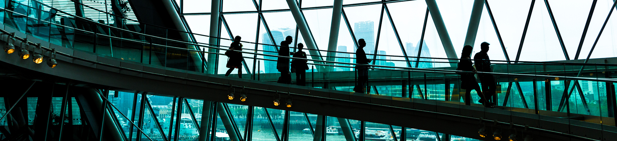 People walking along a ramp inside a building