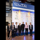 Seven people wearing formal attire lined shoulder to shoulder up for a photo under the CLTC logo